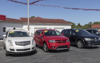 Row of cars for sale on a car lot